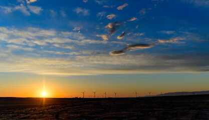 Wind turbines at sunset in the state of Idaho, Scenic view of wind turbines power generator