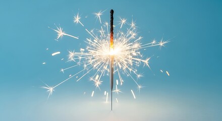 Obraz premium Sparkler burning brightly against a blue background celebration festive cheer