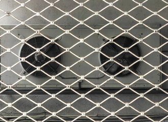 Behind the Grid — Ventilation System. Abstract Robot Eyes.