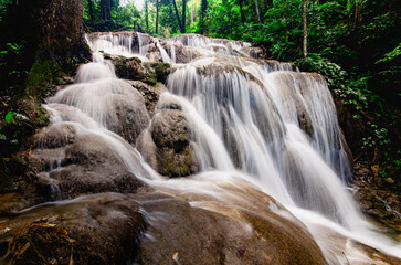 Pu Kaeng Waterfall, the most beautiful limestone waterfall in Chiang Rai Province, Thailand. A peaceful natural atmosphere in the countryside of Northern Thailand.