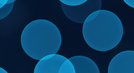 Abstract Blue Circles Bokeh Lights Background with Soft Focus Effect and Dark Navy Backdrop