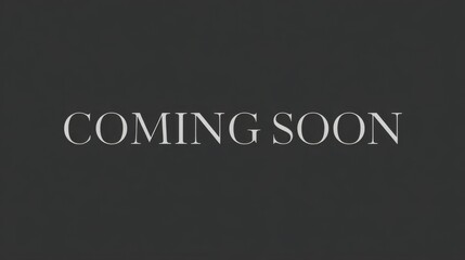 COMING SOON elegant serif text on dark background with minimalist classic design and high contrast