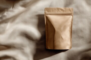 Paper kraft coffee packaging on fabric
