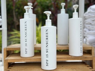 shampoo and soap sunscreen in a pump bottle 