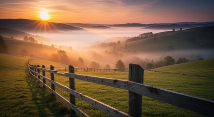 Golden sunrise illuminates misty rolling hills