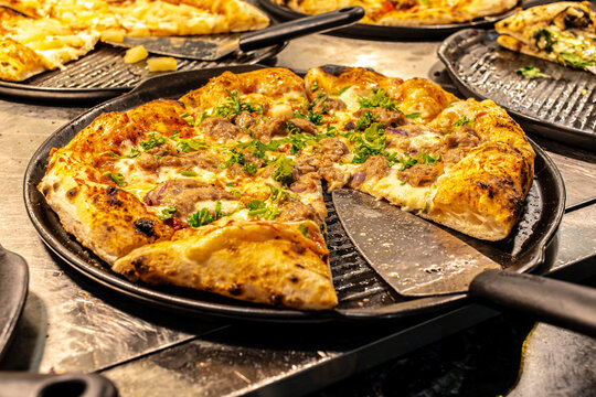 Delicious photo of a freshly baked pizza with cheese, tomato sauce, and assorted toppings. 