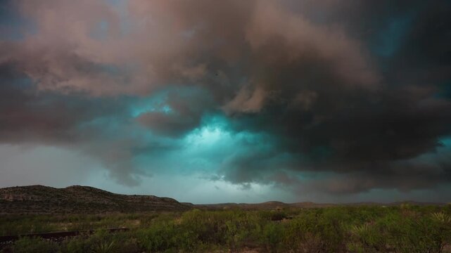 owerful supercell forming in fast motion over wide open prairie horizon 