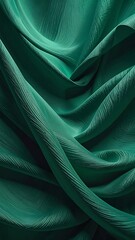 Emerald green fabric drapes in swirling folds