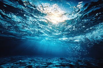 Sunlight filters through clear water creating a serene underwater atmosphere in a tranquil ocean setting