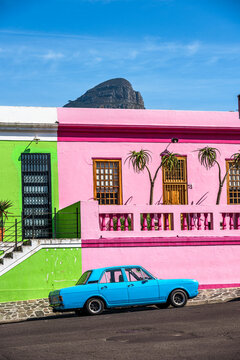 An oldtimer parks in front of the colorful houses in the historic Bo-Kaap district in Cape Town, South Africa