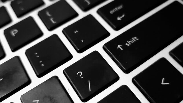 A backlit Enter key intensely glows, drawing focus, while motion blur streaks the surrounding keys, giving a sense of dynamic movement toward the brightly lit focal point.
