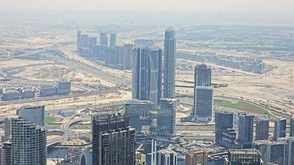 Dubai, UAE, March 28, 2024: An aerial view of Dubai's sprawling cityscape with skyscrapers and roads.