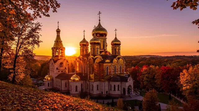 Golden Domed Church at Sunset in Autumn - This video captures a beautiful Russian Orthodox church with golden domes, bathed in the warm glow of a sunset during autumn.