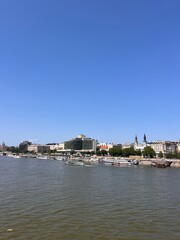 Obraz premium The views from Budapest's iconic Liberty Bridge (Szabadság híd) against a bright blue sky in the middle of Summer in Europe.