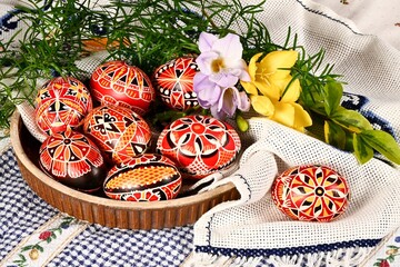 Easter, spring holiday - beautiful colorful Easter eggs, Czech home tradition of decorating with wax,
still life with Easter eggs and spring flowers,