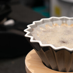 Coffee filter with ground coffee ready for brewing.