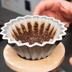 Coffee filter with ground coffee ready for brewing.