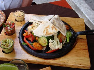 veggie fajitas Mexican food dish with tortillas
