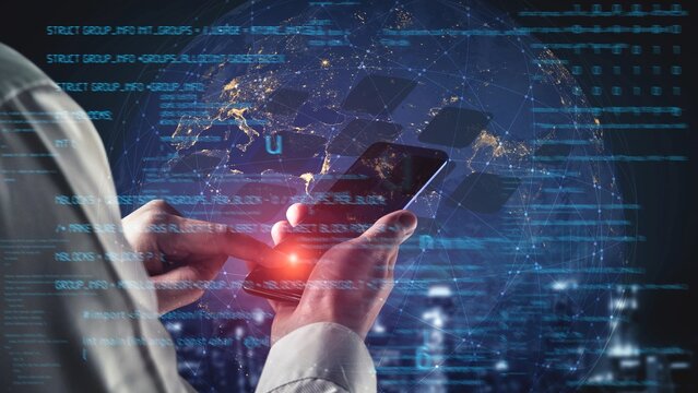 Hands interact with a smartphone displaying a high-tech interface, symbolizing innovation in global communication and data connectivity within an urban setting. Xenic