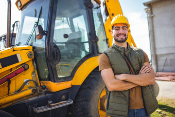 Young excavator operator standing in front of excavator