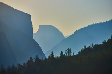 Half Dome at Sunrise with Misty Mountain Layers and Pine Forest Yosemite Morning