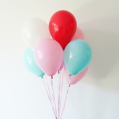 A bunch of balloons in various colors, including red, white, and blue