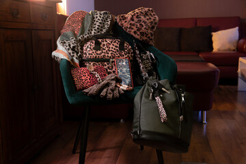 wardrobe with leopard print on bags, scarves, hats, shoelaces, and gloves, including smartphone screen protectors as a statement of feminine style.