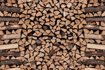 Neatly stacked stack of firewood, firewood for the fireplace, firewood, raw materials