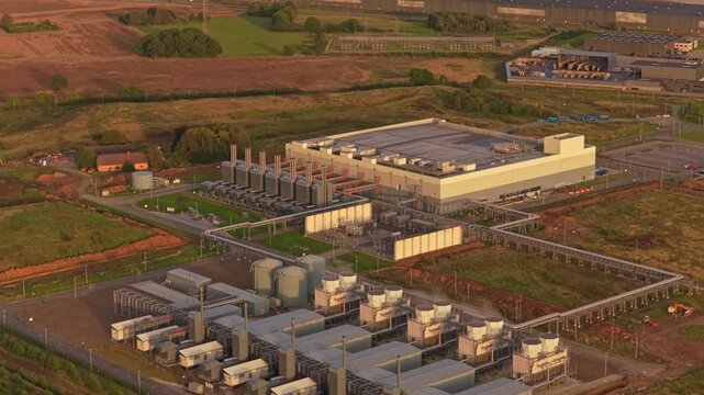 Drone view of Google network hub glowing under sunset sky