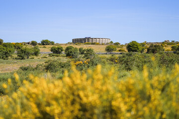 In the background of the image you can see the large water treatment plant located in the fields of...