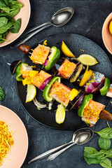 Fresh raw salmon skewers, ready to cook.