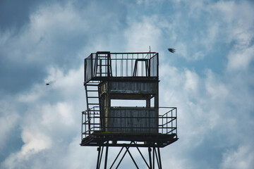 Abandoned Military Watchtower Against a Dramatic Cloudy Sky