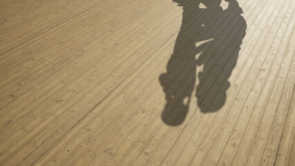 Concept or conceptual background of floor texture surface with a human shadow as silhouette. A 3d illustration metaphor to young childhood education, fun happy family child parent relationship design