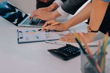 Accounting company provide finance and taxation planning for profitable cash flow, Auditor and accountant team working in office, analyze financial data and accounting record with calculator.Insight