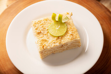 Carlota de Limon, a cold, no-bake dessert made with layers of Maria cookies and a creamy mixture of lemon and condensed milk, an easy homemade recipe very popular in Mexico.