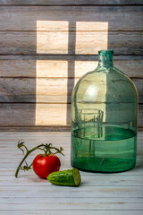 Still life with vegetables and glass dishes