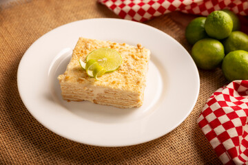 Carlota de Limon, a cold, no-bake dessert made with layers of Maria cookies and a creamy mixture of lemon and condensed milk, an easy homemade recipe very popular in Mexico.