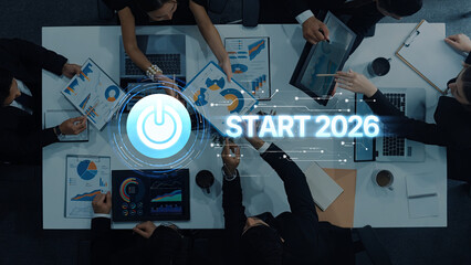 A vibrant meeting scene captures a diverse team engaged in strategic planning for 2026, exploring growth opportunities through charts and data presentations. Trope