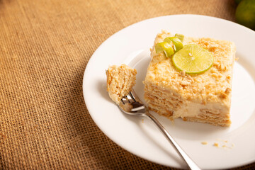 Carlota de Limon, a cold, no-bake dessert made with layers of Maria cookies and a creamy mixture of lemon and condensed milk, an easy homemade recipe very popular in Mexico.