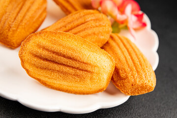 Madeleine cookies sweet dessert traditional french sweets tasty snack fresh delicious gourmet food background on the table rustic top view copy space