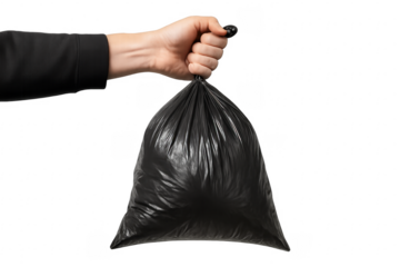Hand holding black plastic garbage bag for disposal