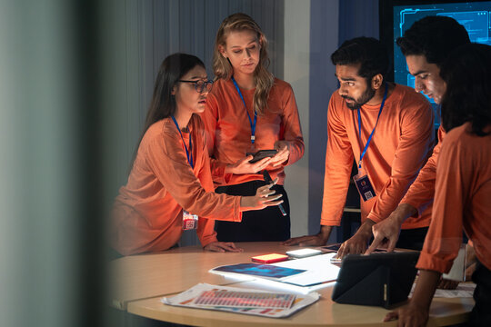 Diverse developer team having meeting and brainstorming idea of product development. Planning strategy to launch project. Tech innovation, intensive teamwork and corporate consultation