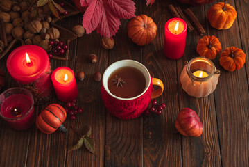 Cozy Autumn Scene with Mulled Wine, Candles, Pumpkins and Seasonal Decor