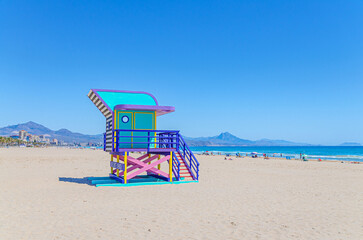 Playa de San Juan beach in Alicante city, colorful Lifeguard Hut Lifeguard Tower on sandy beach of...