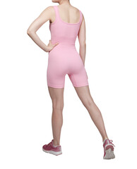 Close-up of a woman's lower torso wearing grey ribbed high-waisted shorts. White background. Fitness, activewear, sportswear concept.
