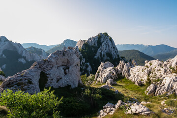 Stunning panoramic view of unique white karst formations and green valleys of the Velebit mountains.  Breathtaking Croatian landscape near Karlobag is a paradise for hikers and nature lovers alike.