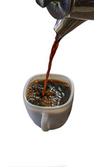 A stream of black coffee being poured from a metal pot into a white ceramic cup, with bubbles forming on the surface. Studio shot isolated and cut out on a transparent background.