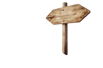 Wooden directional signpost stands on sandy dune under bright sky indicating paths for exploration and adventure in a coastal landscape