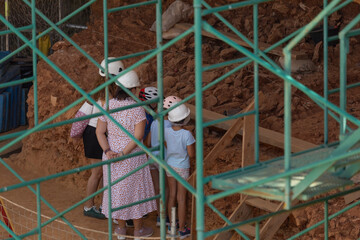 A family visits the prehistoric site in the Atapuerca mountain range, Burgos, archaeological site,...