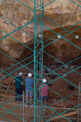 A family visits the prehistoric site in the Atapuerca mountain range, Burgos, archaeological site, paleontological site